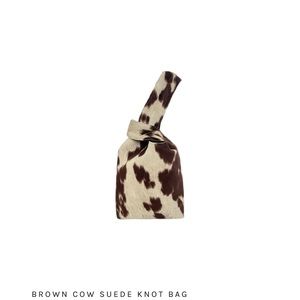 Brown cow print handle bag from Yaito